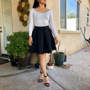 Maje black pleated skirt with beaded hem